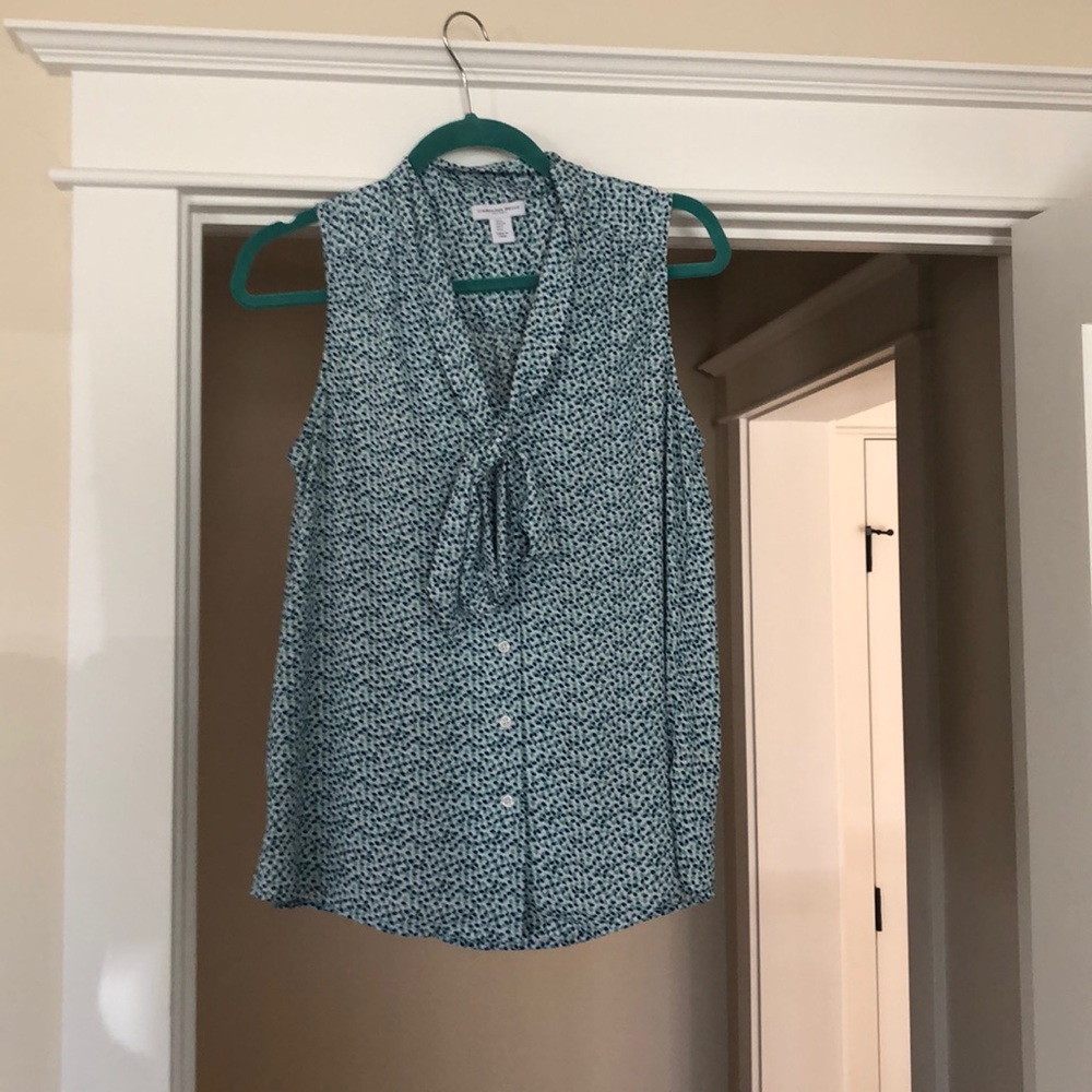 Sleeveless polka dot blouse with tie front